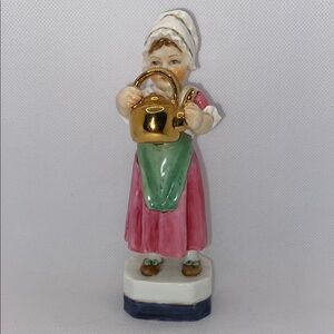 Porcelain Figurine with Gold Accents